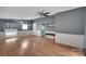 Bright living room with hardwood floors and ceiling fan at 102 Goodman Ne Cir, Concord, NC 28025