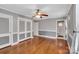 Main bedroom with hardwood floors and ceiling fan at 102 Goodman Ne Cir, Concord, NC 28025