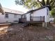 Backyard view showing a deck and additional structure at 406 Harris Ln, Monroe, NC 28112