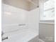 Clean bathroom featuring a bathtub and window at 406 Harris Ln, Monroe, NC 28112