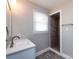 Modern bathroom with grey tile shower and vanity at 406 Harris Ln, Monroe, NC 28112