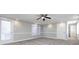 Spacious bedroom with carpet, ceiling fan, and ample natural light at 406 Harris Ln, Monroe, NC 28112