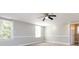 Well-lit bedroom with carpet, ceiling fan and neutral walls at 406 Harris Ln, Monroe, NC 28112