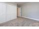 Spacious bedroom with double door closet and neutral walls at 406 Harris Ln, Monroe, NC 28112