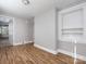 Spacious bedroom with hardwood floors and built-in shelving at 406 Harris Ln, Monroe, NC 28112