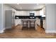 Modern kitchen with white cabinets, granite counters, and stainless steel appliances at 406 Harris Ln, Monroe, NC 28112
