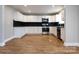 Modern kitchen with white cabinets, granite counters, and stainless steel appliances at 406 Harris Ln, Monroe, NC 28112