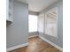 Bright laundry room with tile floor and corner windows at 406 Harris Ln, Monroe, NC 28112