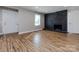 Living room featuring hardwood floors and a modern fireplace at 406 Harris Ln, Monroe, NC 28112