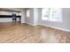 Open concept living area with hardwood floors and kitchen access at 406 Harris Ln, Monroe, NC 28112