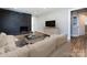 Living room with comfy seating and a modern fireplace at 406 Harris Ln, Monroe, NC 28112