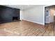 Spacious living room with hardwood floors and a modern fireplace at 406 Harris Ln, Monroe, NC 28112
