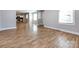 Open concept living area with hardwood floors and kitchen access at 406 Harris Ln, Monroe, NC 28112