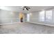 Main bedroom with carpet, ceiling fan, and access to bathroom at 406 Harris Ln, Monroe, NC 28112