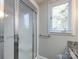 Clean shower with glass enclosure and grab bar at 406 Harris Ln, Monroe, NC 28112