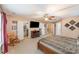 Spacious main bedroom with walk-in closet and ceiling fan at 5040 Timber Falls Dr, Indian Land, SC 29707