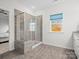 Bathroom with walk-in shower, built-in bench and window at 829 River Park Rd, Belmont, NC 28012