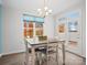 Bright dining area with table and chairs, offering views of the backyard at 829 River Park Rd, Belmont, NC 28012