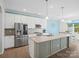 Modern kitchen with stainless steel appliances, granite countertops, and an island at 829 River Park Rd, Belmont, NC 28012