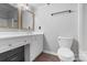Bathroom features a white vanity with drawers and brushed nickel fixtures, and a toilet at 958 Sherwood Cir, Lancaster, SC 29720