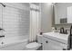 Bathroom features a vanity and shower-over-tub with subway tile surround at 958 Sherwood Cir, Lancaster, SC 29720