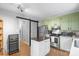 Modern kitchen with stainless steel appliances, green cabinets, and a convenient center island at 958 Sherwood Cir, Lancaster, SC 29720