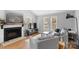 Inviting living room featuring a stone fireplace, gray sofas, and large windows for ample natural light at 958 Sherwood Cir, Lancaster, SC 29720