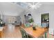 Bright open-concept living space with modern lighting, dining area, and kitchen, perfect for entertaining at 958 Sherwood Cir, Lancaster, SC 29720