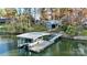 Covered boat dock with lift and walkway, perfect for lake access at 110 Fern Haven Ln, Mooresville, NC 28117