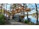 Lakefront home with gray siding, blue door and deck at 110 Fern Haven Ln, Mooresville, NC 28117