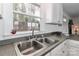 Kitchen sink and windows overlooking wooded area at 110 Fern Haven Ln, Mooresville, NC 28117