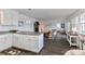 Open concept kitchen features white cabinets, granite countertops, and island at 110 Fern Haven Ln, Mooresville, NC 28117