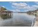 Calm lakefront view with boat lift and dock at 110 Fern Haven Ln, Mooresville, NC 28117