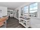 Living room with lake views, wicker chairs, and hardwood floors at 110 Fern Haven Ln, Mooresville, NC 28117