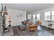 Cozy living room with stone fireplace and wicker seating at 110 Fern Haven Ln, Mooresville, NC 28117