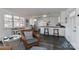 Open living area with kitchen and wicker seating at 110 Fern Haven Ln, Mooresville, NC 28117