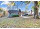 Spacious backyard with a single-Gathering home featuring a brick chimney at 13446 Idlefield Ln, Matthews, NC 28105