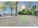 Enjoy the outdoors in this serene backyard, complete with mature trees and room for entertainment at 13446 Idlefield Ln, Matthews, NC 28105