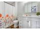 Updated bathroom with a shower/tub combo and a modern white vanity at 13446 Idlefield Ln, Matthews, NC 28105