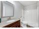 Cozy bathroom featuring a tub and updated vanity with a granite countertop at 13446 Idlefield Ln, Matthews, NC 28105