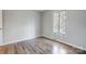 Bright and airy bedroom with hardwood floors and natural lighting at 13446 Idlefield Ln, Matthews, NC 28105