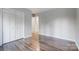 Spacious bedroom featuring hardwood floors and a sizable closet at 13446 Idlefield Ln, Matthews, NC 28105