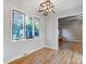 Dining room filled with natural light from large window, featuring modern light fixture at 13446 Idlefield Ln, Matthews, NC 28105