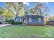 Charming blue home with well-manicured lawn and mature trees in a quiet neighborhood at 13446 Idlefield Ln, Matthews, NC 28105