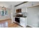 Kitchen featuring white cabinets, stainless steel appliances, and a view into dining room at 13446 Idlefield Ln, Matthews, NC 28105
