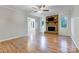 Bright living room featuring a brick fireplace and fresh paint at 13446 Idlefield Ln, Matthews, NC 28105