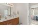 Bathroom featuring double sinks, wood cabinets, and plenty of counter space at 3015 Hendricks Chapel Ln, Charlotte, NC 28216