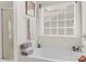 Relaxing bathtub area with a large window, natural light, and modern fixtures at 3015 Hendricks Chapel Ln, Charlotte, NC 28216
