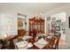 Formal dining room with elegant hardwood table, seating for six, chandelier, and traditional decor at 3015 Hendricks Chapel Ln, Charlotte, NC 28216