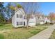Attractive two-story home featuring a well-maintained lawn, attached garage, and classic architectural details at 3015 Hendricks Chapel Ln, Charlotte, NC 28216